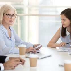 Female leader with employees