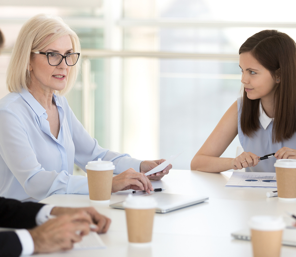 Female leader with employees