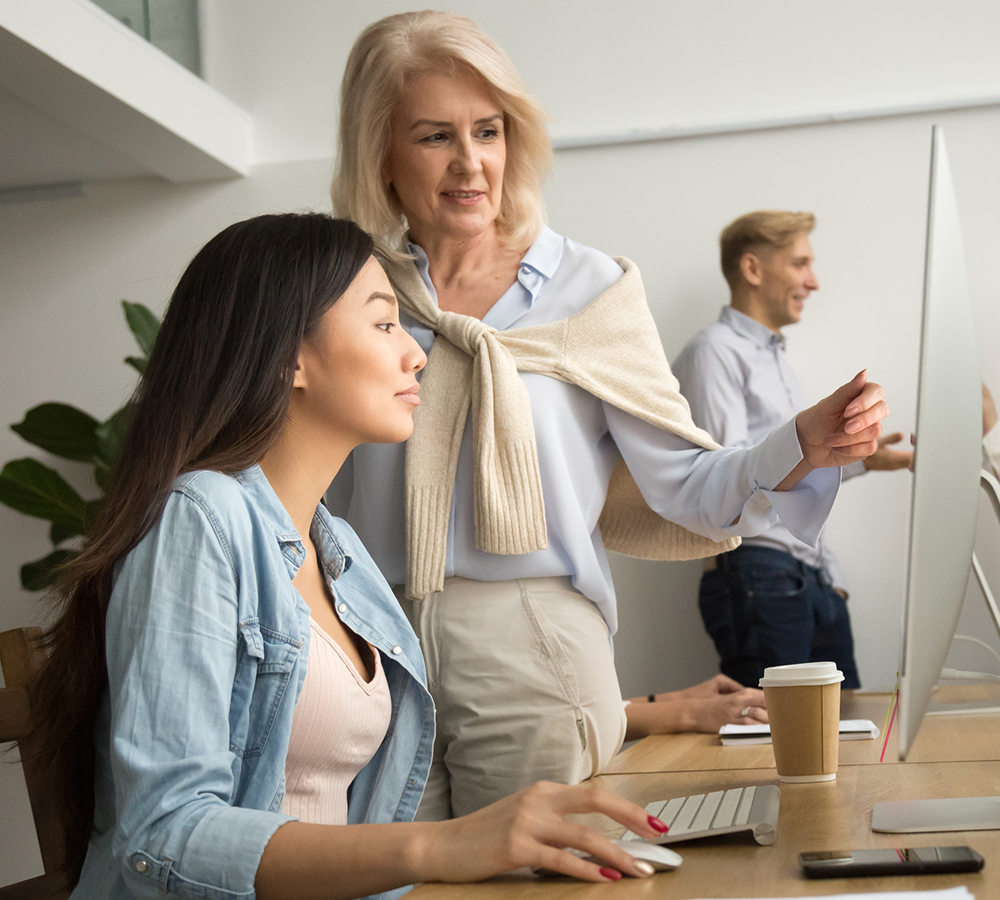 Female mentor helping employee