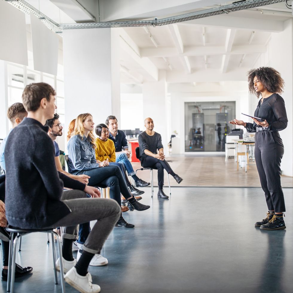 meeting with woman talking to group