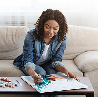 Woman painting at home