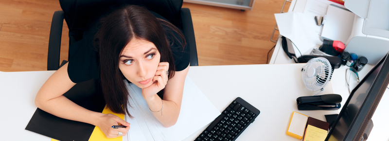 woman spacing out at desk